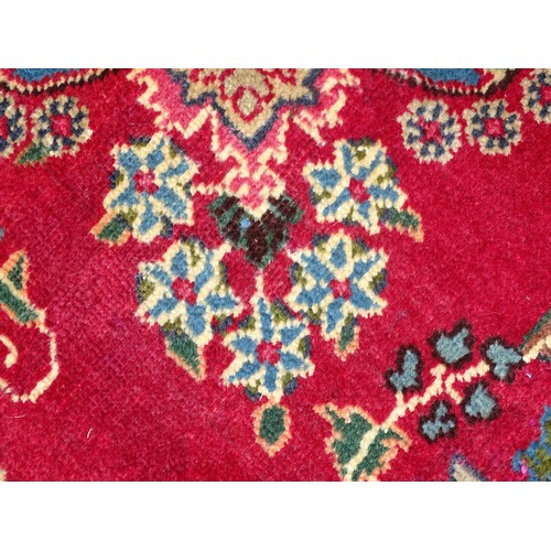 1277 - Carpet / Rug : A  North East Persian Meshed carpet, the red ground with central medallion having flo... 