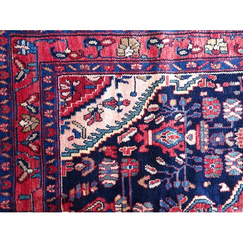 1284 - Carpet / Rug : A  North west Persian Nahawand rug, the blue and red grounds with floral and foliate ... 