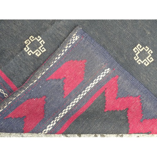 1285 - Carpet /  rug : A  North East Persian Sofreh Kilim, the dark ground with geometric motifs and chevro... 