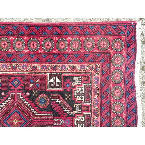 1289 - Carpet / Rug : A North east Persian meshed Belouch rug with geometric motifs and banded borders with... 