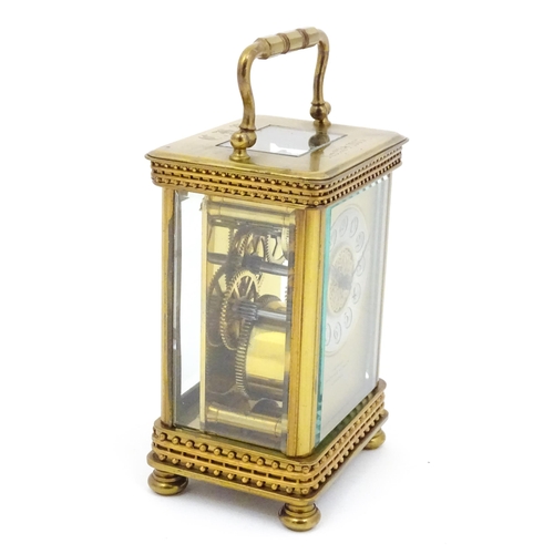 1296 - An early 20thC French carriage clock by Richard et Cie with Arabic numerals to dial and signed to fr... 