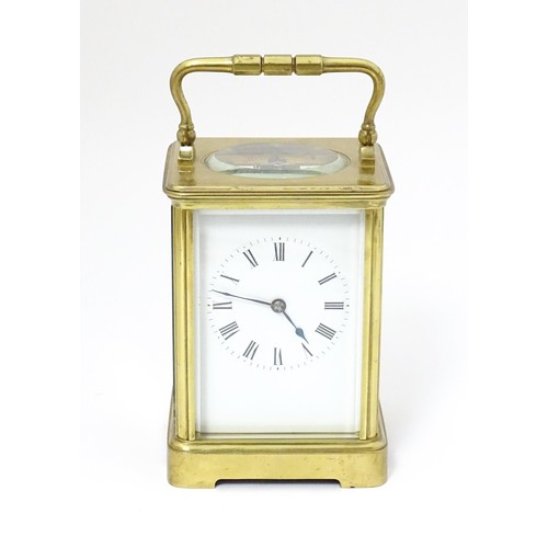 1298 - A late 19th / early 20thC French brass corniche cased carriage clock, by Richard & Cie. Having ename... 