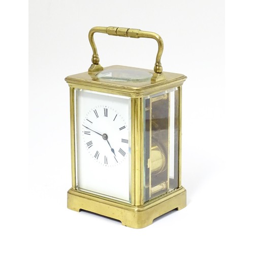 1298 - A late 19th / early 20thC French brass corniche cased carriage clock, by Richard & Cie. Having ename... 