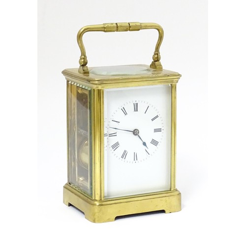 1298 - A late 19th / early 20thC French brass corniche cased carriage clock, by Richard & Cie. Having ename... 