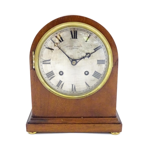 1299 - A mahogany cased mantle clock, the silvered dial with roman numerals and signed Robert Sawers Edinbu... 