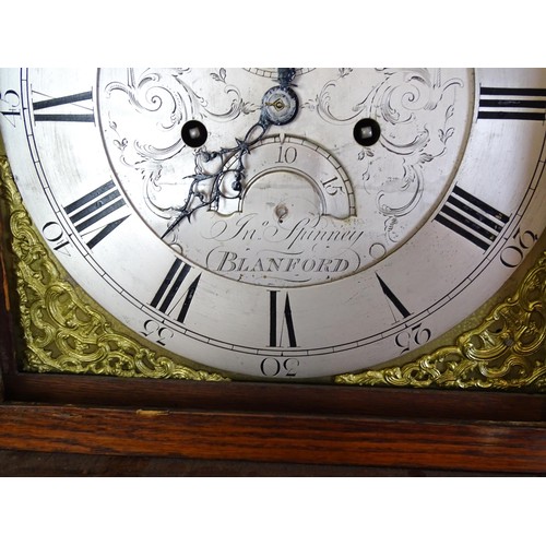 1307 - A late 18thC oak cased 8-day longcase clock. The silvered dial with Roman and Arabic numerals, subsi... 