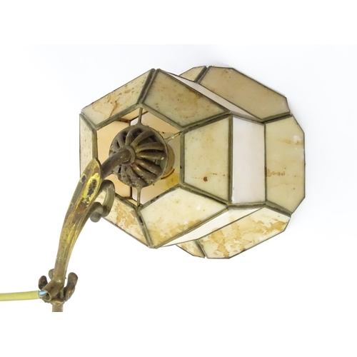 1310 - A 20thC twin pendant rise and fall ceiling lamp of scrolling form with twin shades. Approx 25