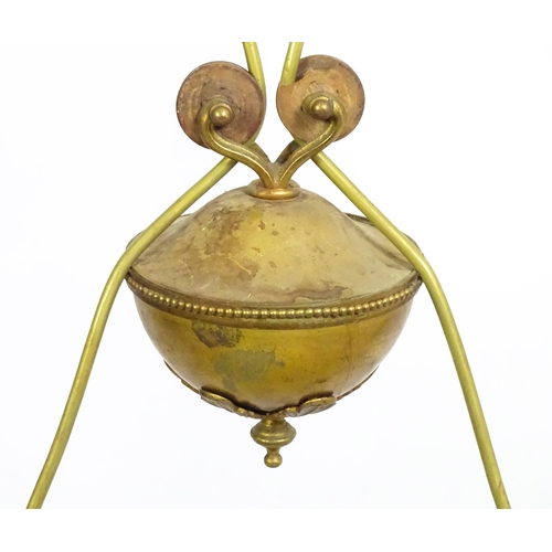 1310 - A 20thC twin pendant rise and fall ceiling lamp of scrolling form with twin shades. Approx 25