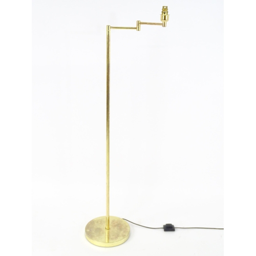 1316 - A brass standard lamp with adjustable arm. Approx 54