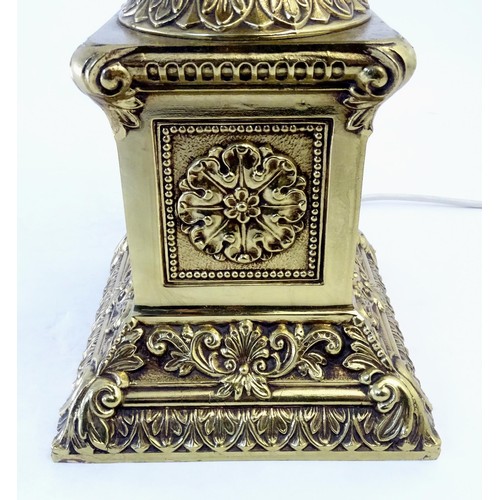 1320 - A gilt metal table lamp of twin handled urn form. Approx. 28