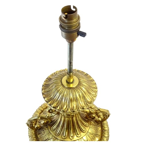 1320 - A gilt metal table lamp of twin handled urn form. Approx. 28