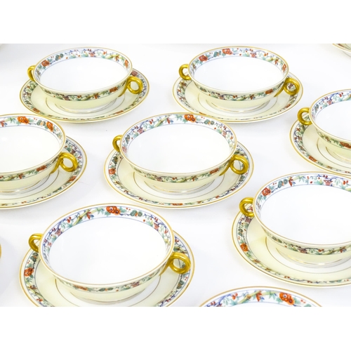 171 - A quantity of Haviland Limoges dinner wares with banded foliate border, to include plates, serving p... 