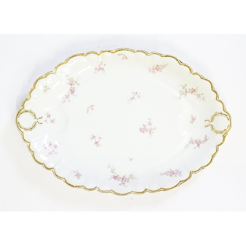 172 - A quantity of Haviland Limoges dinner wares with floral decoration and gilt borders to include plate... 