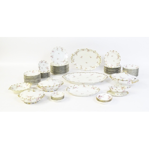 172 - A quantity of Haviland Limoges dinner wares with floral decoration and gilt borders to include plate... 