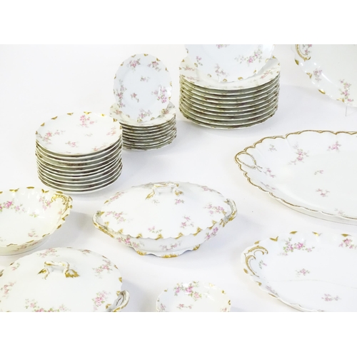 172 - A quantity of Haviland Limoges dinner wares with floral decoration and gilt borders to include plate... 