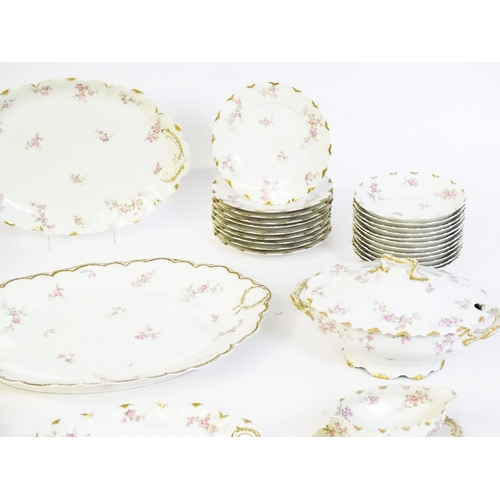 172 - A quantity of Haviland Limoges dinner wares with floral decoration and gilt borders to include plate... 