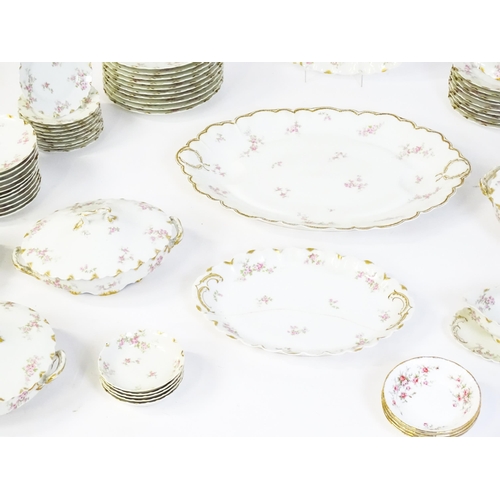 172 - A quantity of Haviland Limoges dinner wares with floral decoration and gilt borders to include plate... 