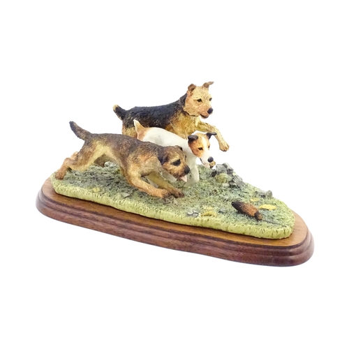 862 - A Border Fine Arts model Terrier Race, by Margaret Turner, model no. B0242. Within a glazed case. Ca... 