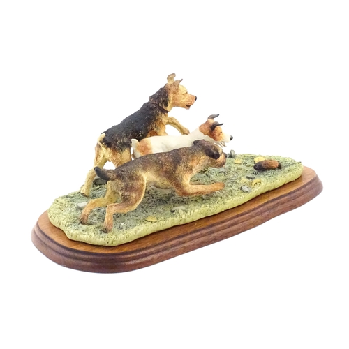 862 - A Border Fine Arts model Terrier Race, by Margaret Turner, model no. B0242. Within a glazed case. Ca... 