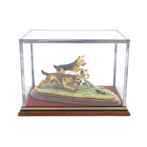 862 - A Border Fine Arts model Terrier Race, by Margaret Turner, model no. B0242. Within a glazed case. Ca... 