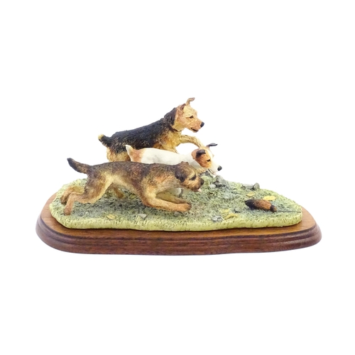 862 - A Border Fine Arts model Terrier Race, by Margaret Turner, model no. B0242. Within a glazed case. Ca... 