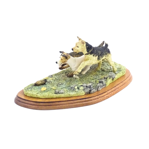 862 - A Border Fine Arts model Terrier Race, by Margaret Turner, model no. B0242. Within a glazed case. Ca... 