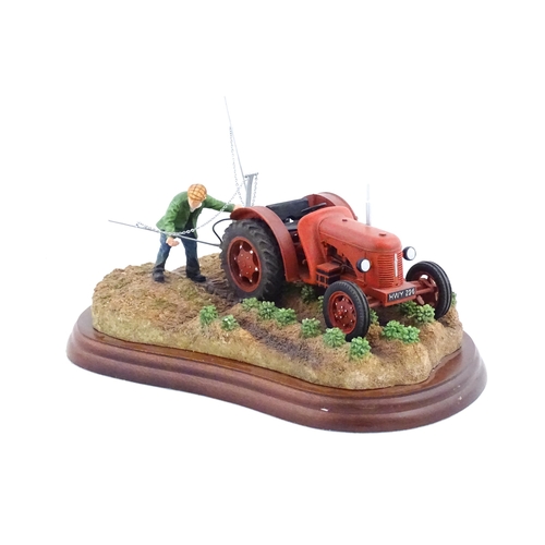 892 - A Border Fine Arts model Tattie Spraying by Ray Ayres, model no. A5894. Model approx. 8 1/2