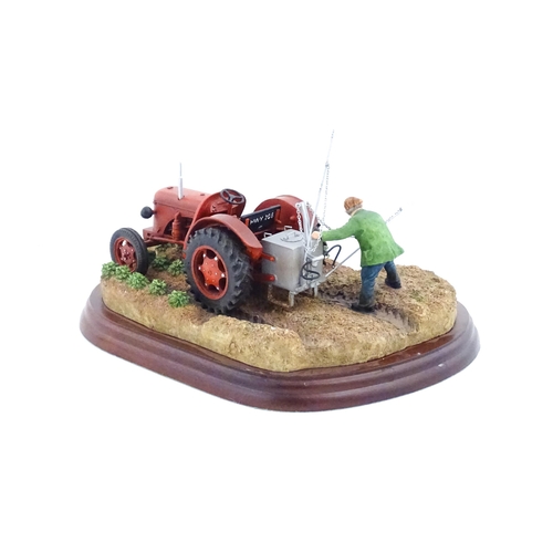 892 - A Border Fine Arts model Tattie Spraying by Ray Ayres, model no. A5894. Model approx. 8 1/2