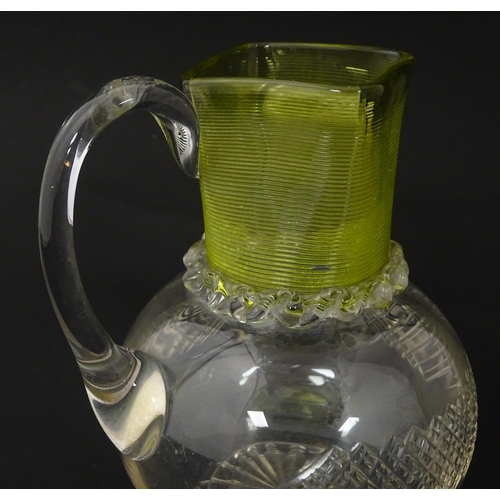 239 - A Victorian water jug and glass with banded yellow detail. Together with a glass stirrer. Jug approx... 