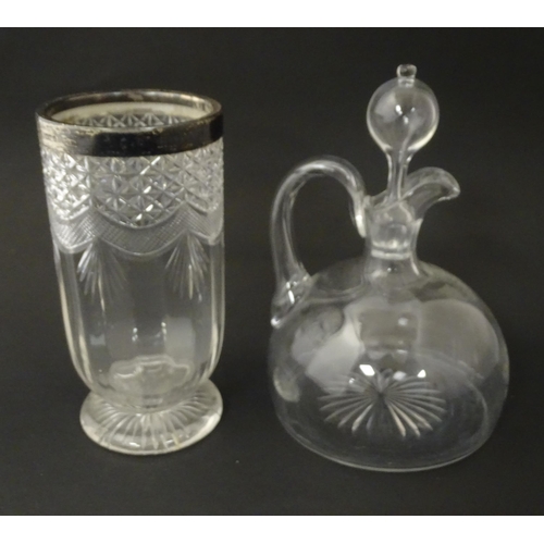 241 - A 19thC whisky water jug and stopper. Together with a 19thC cut glass vase with silver rim, hallmark... 