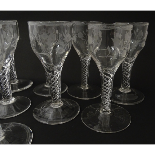 244 - Ten Georgian drinking glasses with air twist detail to stems, the bowls engraved with floral and fol... 