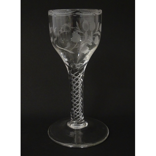 244 - Ten Georgian drinking glasses with air twist detail to stems, the bowls engraved with floral and fol... 