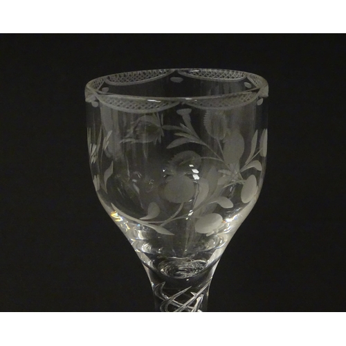 244 - Ten Georgian drinking glasses with air twist detail to stems, the bowls engraved with floral and fol... 