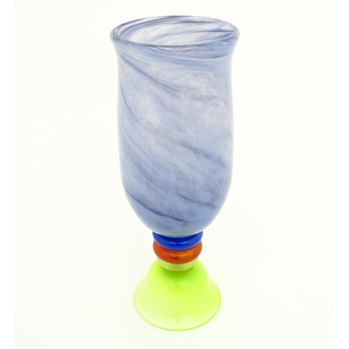 249 - Dan Aston : A large studio glass vase worked in red, blue, lime green and purple glass by Dan Aston.... 