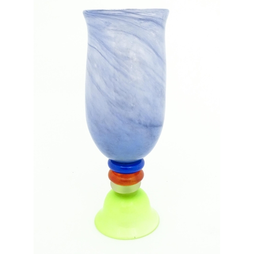 249 - Dan Aston : A large studio glass vase worked in red, blue, lime green and purple glass by Dan Aston.... 