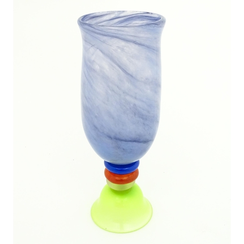 249 - Dan Aston : A large studio glass vase worked in red, blue, lime green and purple glass by Dan Aston.... 