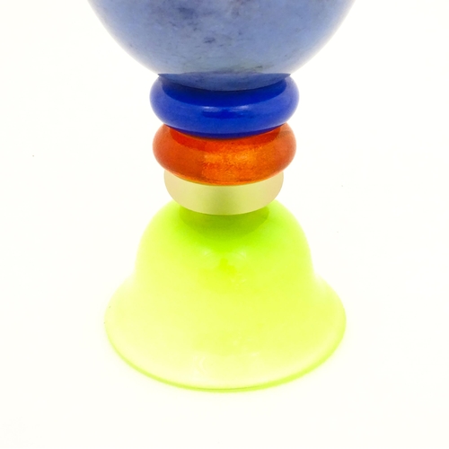 249 - Dan Aston : A large studio glass vase worked in red, blue, lime green and purple glass by Dan Aston.... 