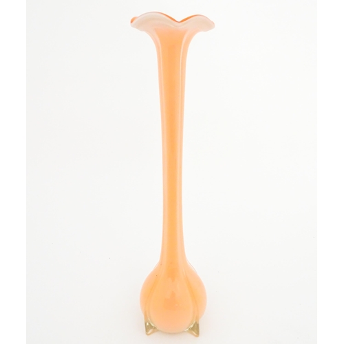 250 - A tall Empoli orange glass vase. Approx. 20