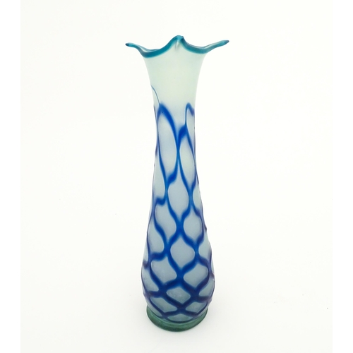 252 - A tall art glass vase with blue and turquoise detail. Approx. 16