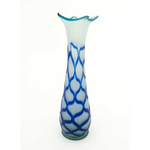 252 - A tall art glass vase with blue and turquoise detail. Approx. 16