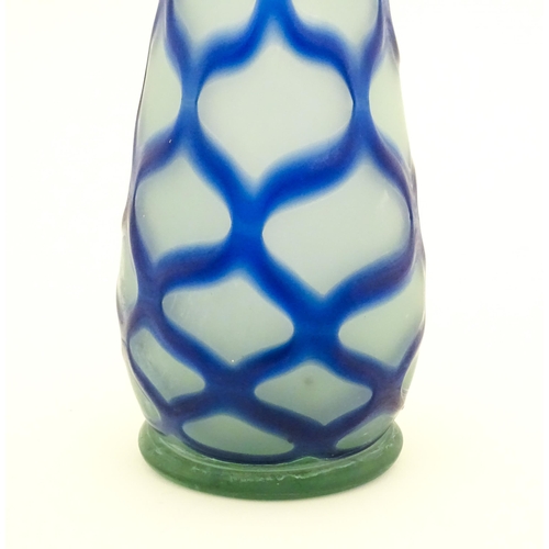 252 - A tall art glass vase with blue and turquoise detail. Approx. 16