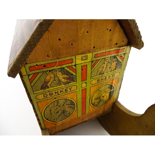 822 - Toys: An early 20thC German Noah's Ark and Animals, the wooden ark with pitched roof and lithograph ... 