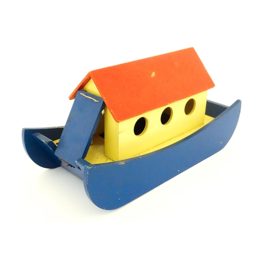 823 - Toys: A 20thC Tiger Toys wooden Noah's Ark with pitched roof, pierced windows and painted detail, wi... 