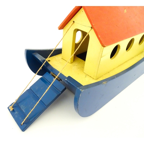 823 - Toys: A 20thC Tiger Toys wooden Noah's Ark with pitched roof, pierced windows and painted detail, wi... 