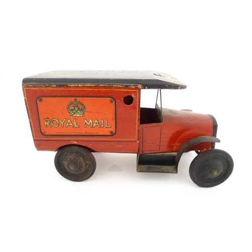 824 - Toy: An early 20thC Triangtois / Triang wooden Royal Mail Ford van, painted red with black and yello... 