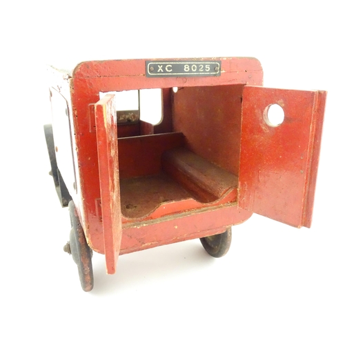 824 - Toy: An early 20thC Triangtois / Triang wooden Royal Mail Ford van, painted red with black and yello... 