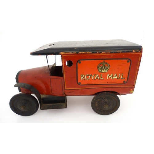 824 - Toy: An early 20thC Triangtois / Triang wooden Royal Mail Ford van, painted red with black and yello... 