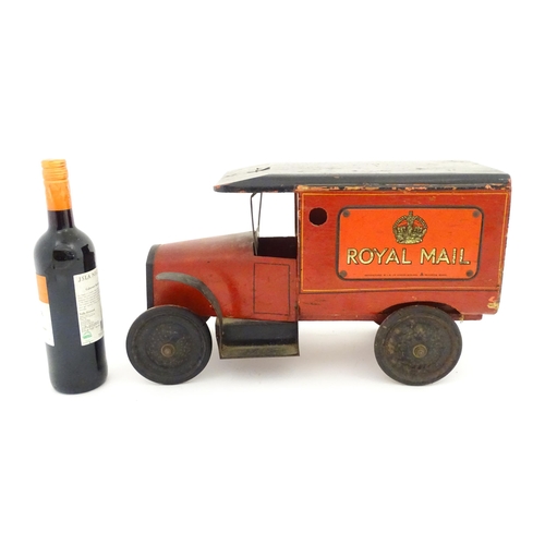 824 - Toy: An early 20thC Triangtois / Triang wooden Royal Mail Ford van, painted red with black and yello... 