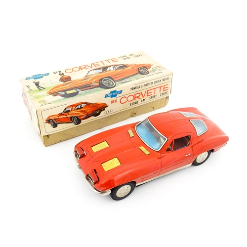 825 - Toy: A 20thC boxed Ichida scale model tinplate battery powered red Chevrolet Corvette Sting Ray Spor... 