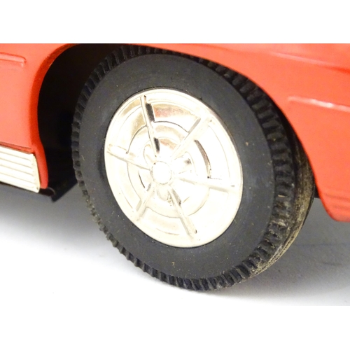 825 - Toy: A 20thC boxed Ichida scale model tinplate battery powered red Chevrolet Corvette Sting Ray Spor... 